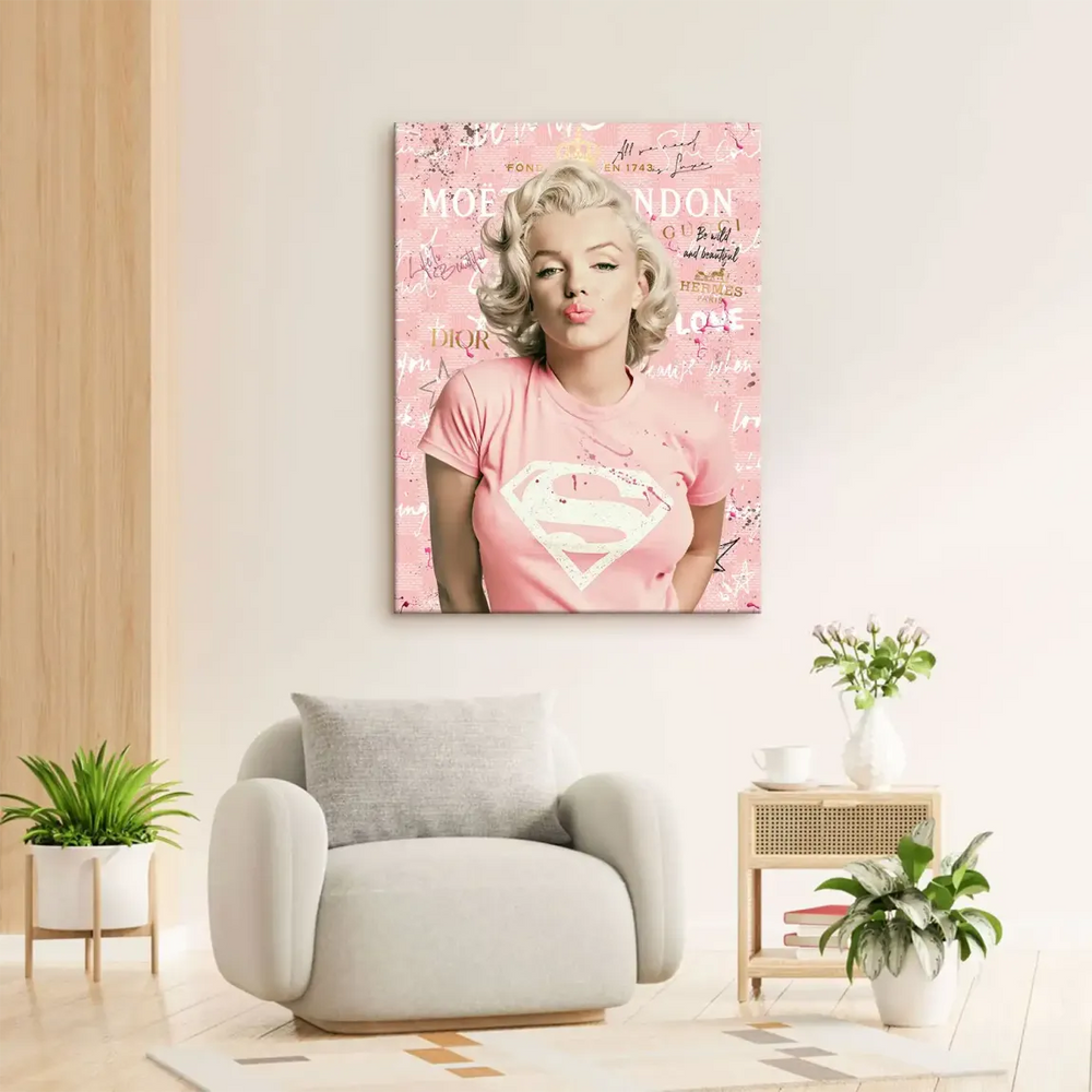 Close-up of Marilyn Monroe's blonde hair and kiss-blown pose in a vibrant pink and gold pop art canvas.