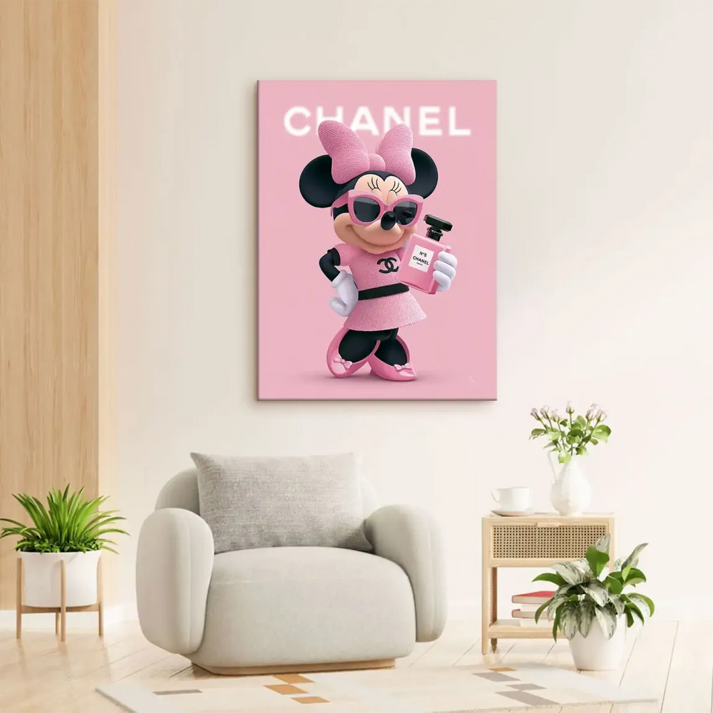 Minnie holding a pink Chanel No. 5 bottle in a chic pose