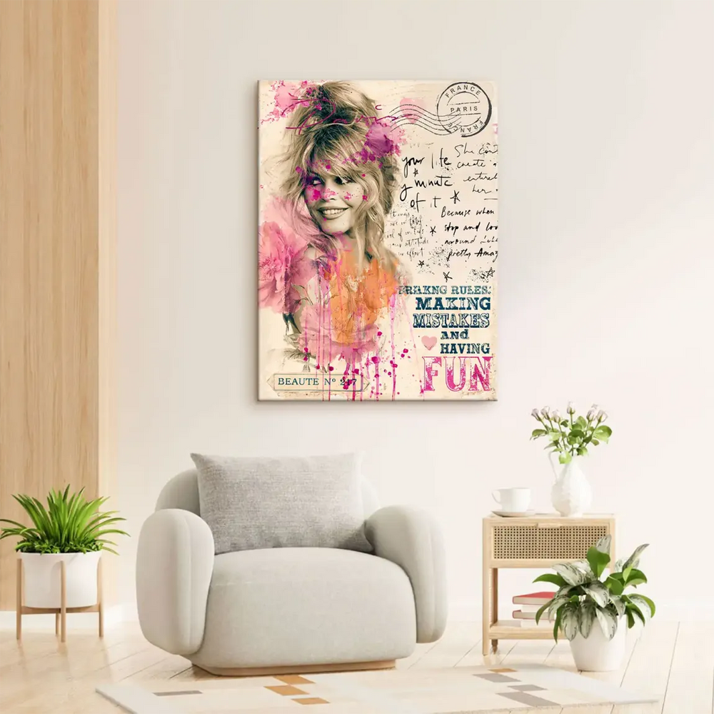 Black-and-white Bardot image with fuchsia and orange paint splashes, handwritten script, and a Paris stamp