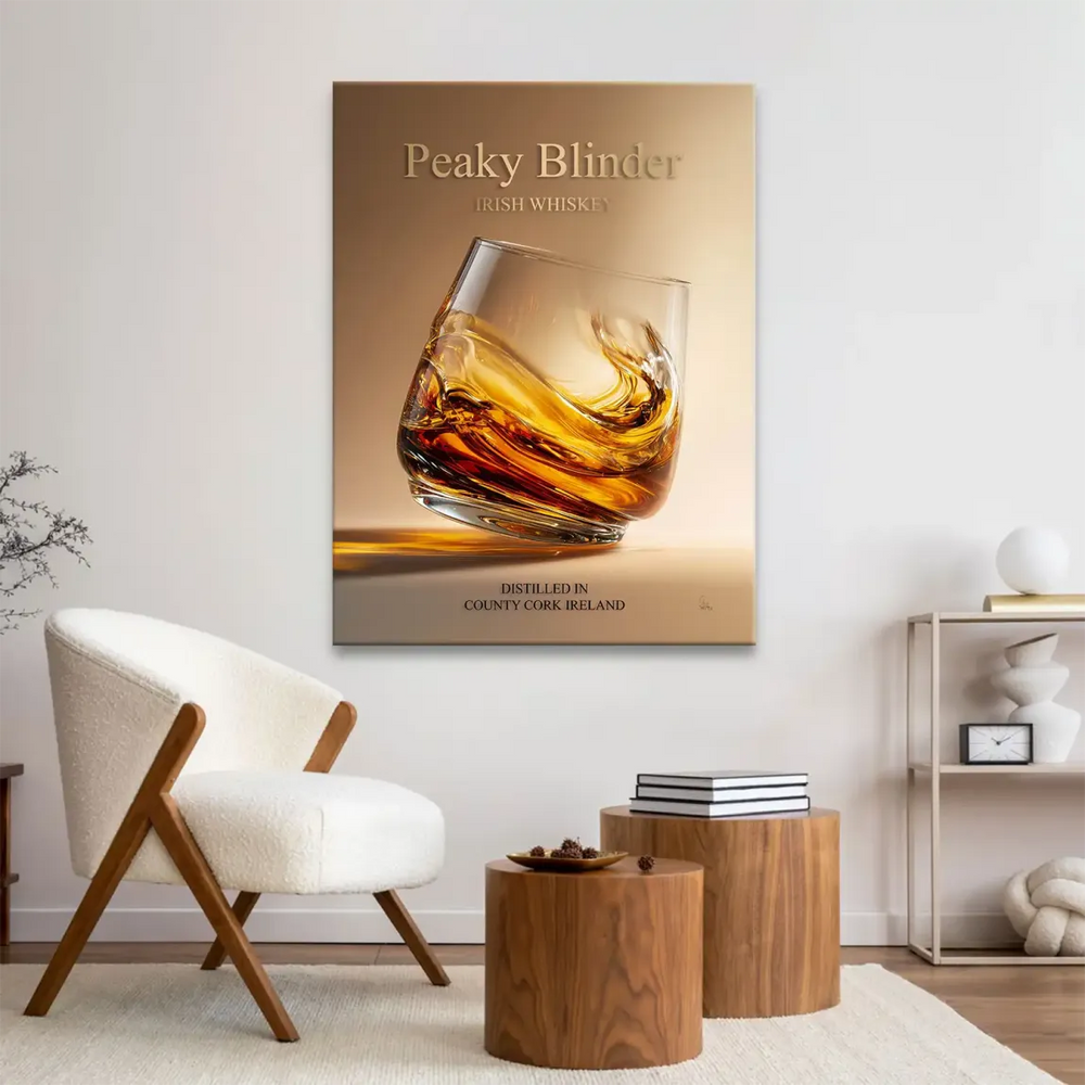 Close-up of glass with whiskey swirl and bold Peaky Blinder IRISH WHISKEY text on canvas