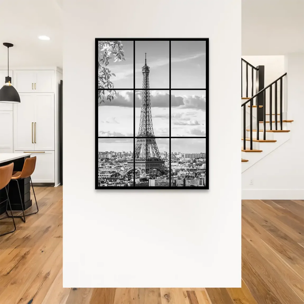 Close-up of the Eiffel Tower against a cloudy sky in grayscale on wall art