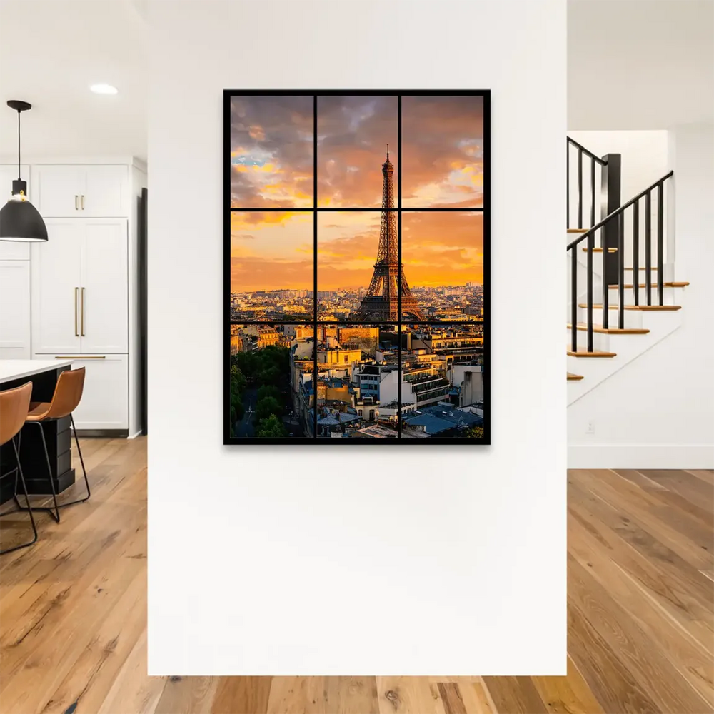 Close-up of the Eiffel Tower against a dramatic orange and red sunset sky