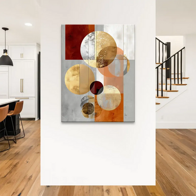 Close-up of shiny circular forms with distressed metal textures against warm reddish-brown and orange tones