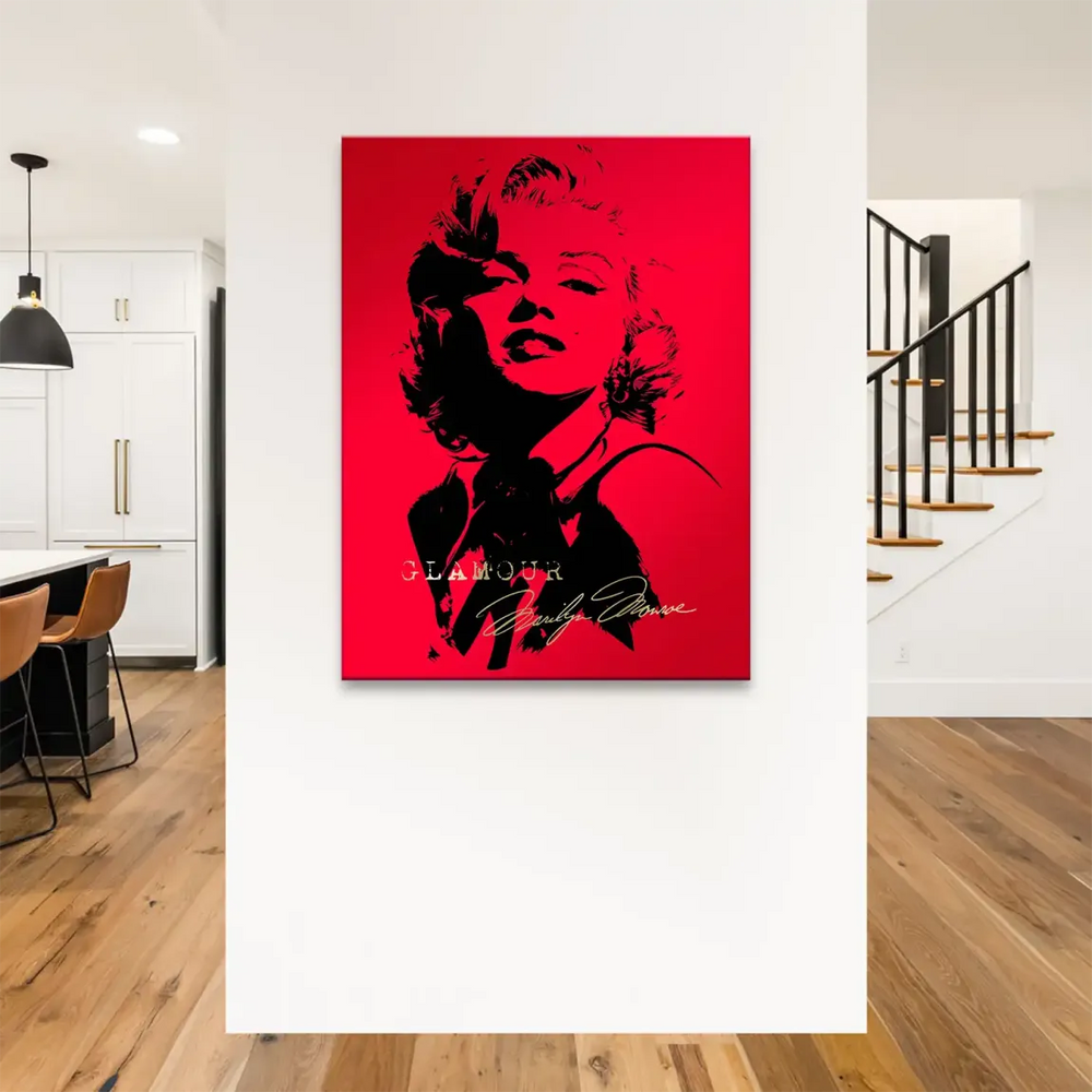 Iconic Marilyn Monroe pop art canvas featuring high-contrast red and black tones and luxe gold signature.