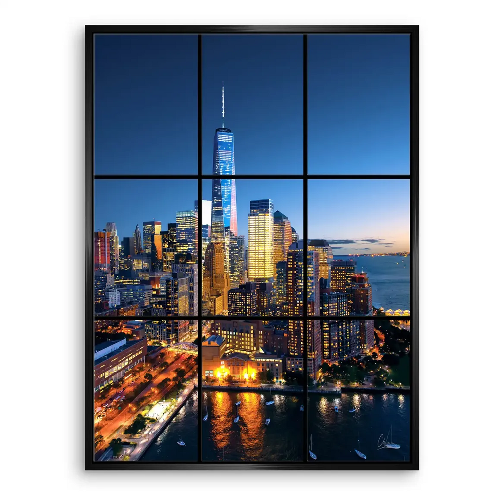 Wide-angle view of New York City's waterfront skyline, featuring illuminated skyscrapers against a dark blue sky.