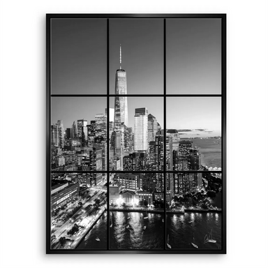 Architectural night view emphasizing vertical lines of towers and reflections on water.
