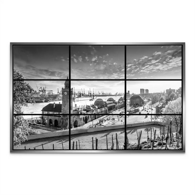 Dramatic, cloud-filled sky above a minimalist cityscape in monochrome.
