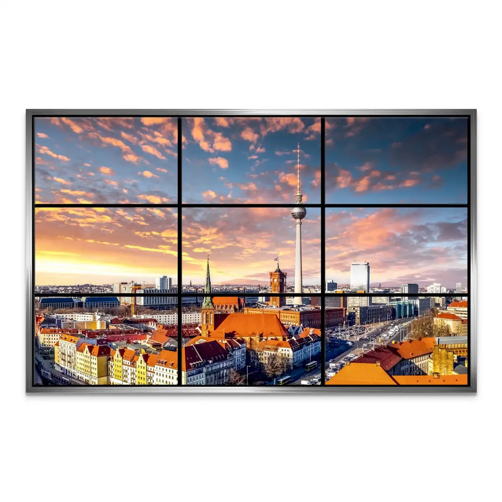 Dramatic sunset over Berlin's skyline with iconic towers and church spires