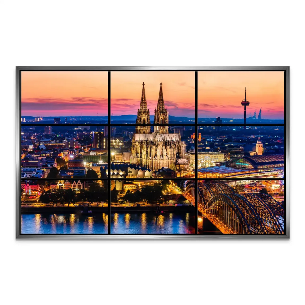 Wide-angle view of Cologne's nightscape with warm evening glow