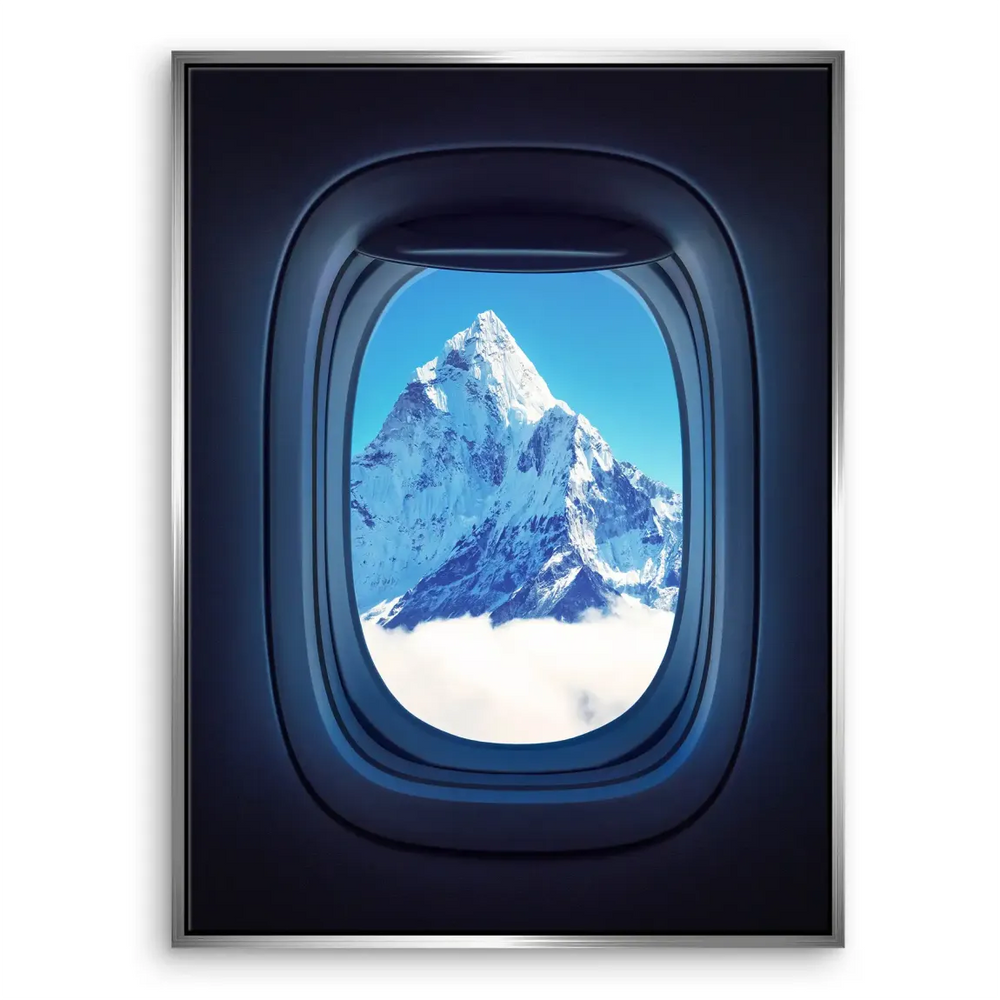 Majestic Everest summit framed by aircraft porthole