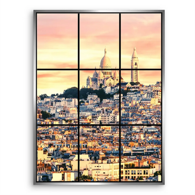 Aerial-like perspective of Paris skyline viewed through window panes at sunrise.