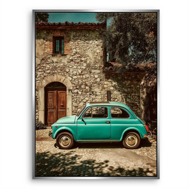 Side view of the teal Fiat 500 with golden light and rustic village backdrop