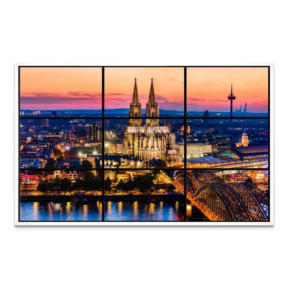 River reflections of illuminated historic buildings along the Cologne waterfront