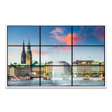 Elevated view of Hamburg cityscape with historic buildings under a sunset palette