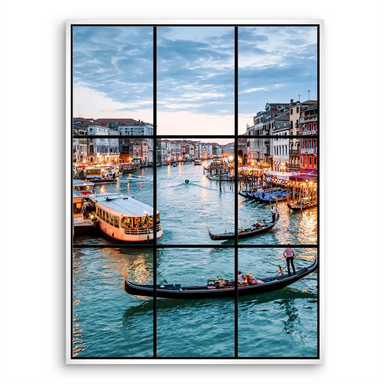 Venice waterway with arched bridges and waterfront buildings at blue hour.